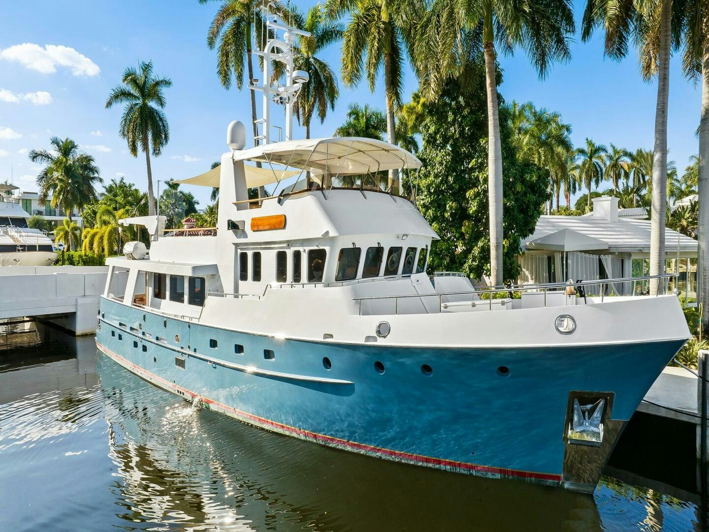 a boat docked at a pier aboard SIENNA Yacht for Sale