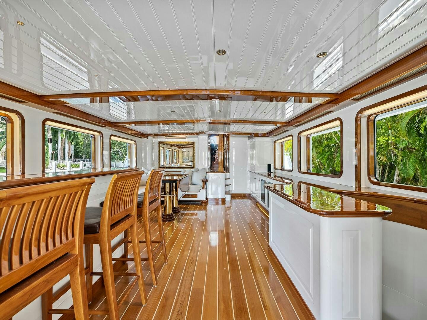 a large room with tables and chairs aboard SIENNA Yacht for Sale