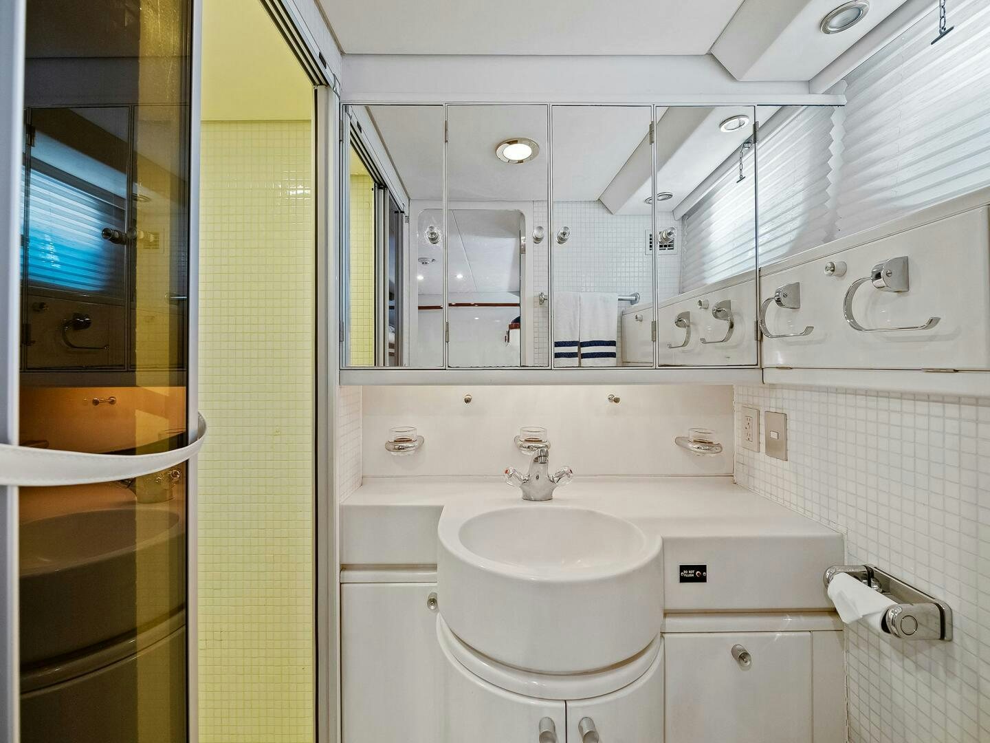 a bathroom with a sink and toilet aboard SIENNA Yacht for Sale