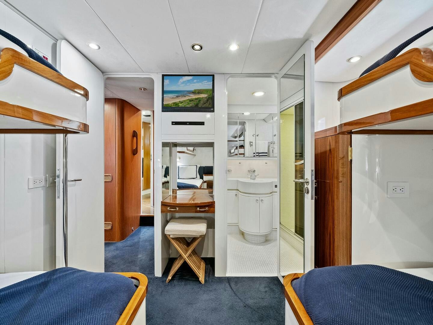 a kitchen with a table and chairs aboard SIENNA Yacht for Sale