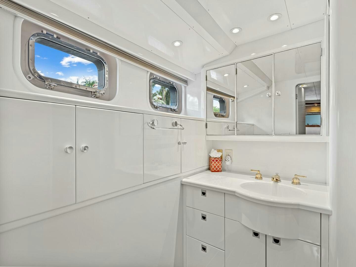 a bathroom with a large mirror aboard SIENNA Yacht for Sale