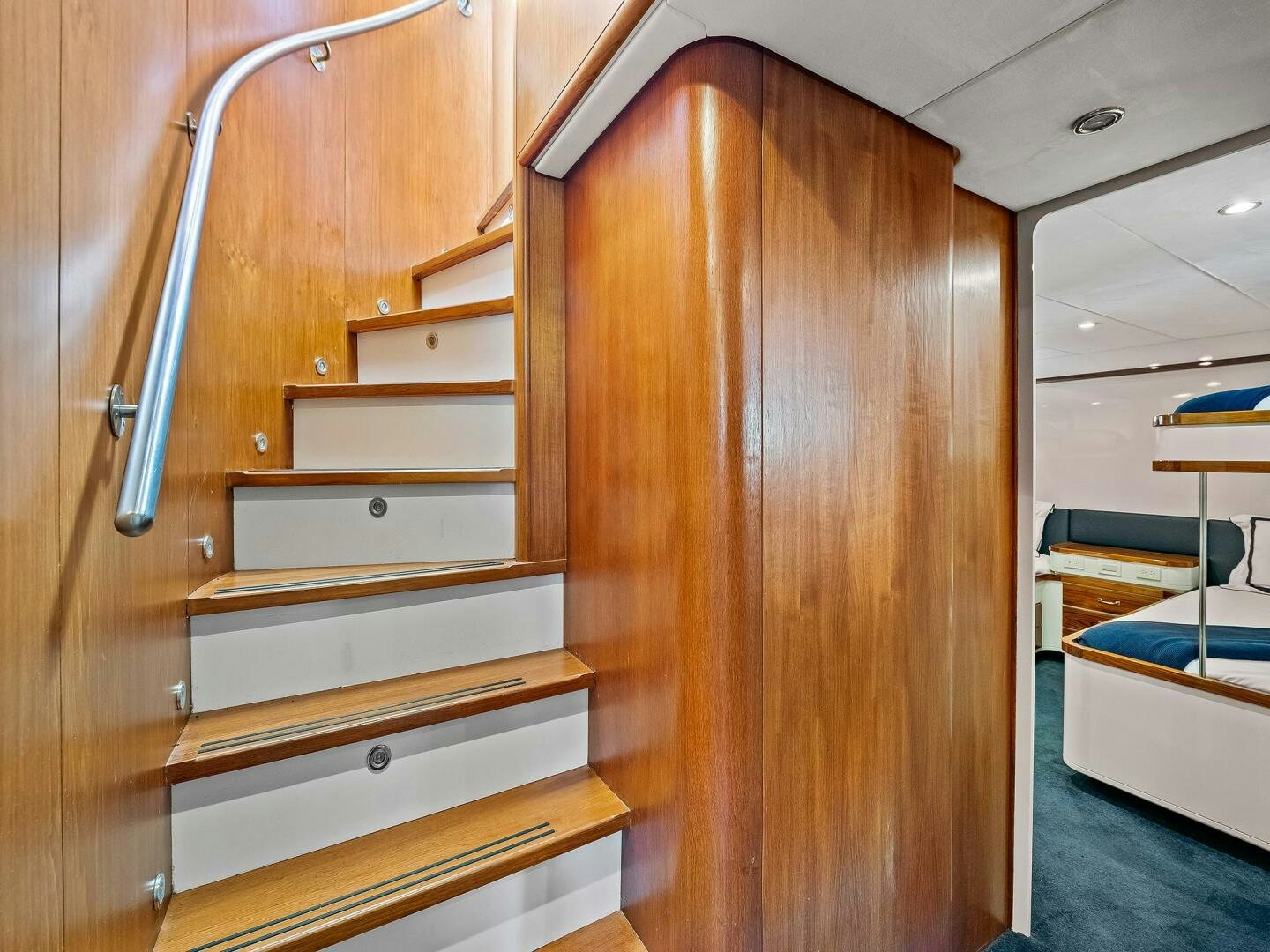 a wooden cabinet with a metal frame aboard SIENNA Yacht for Sale