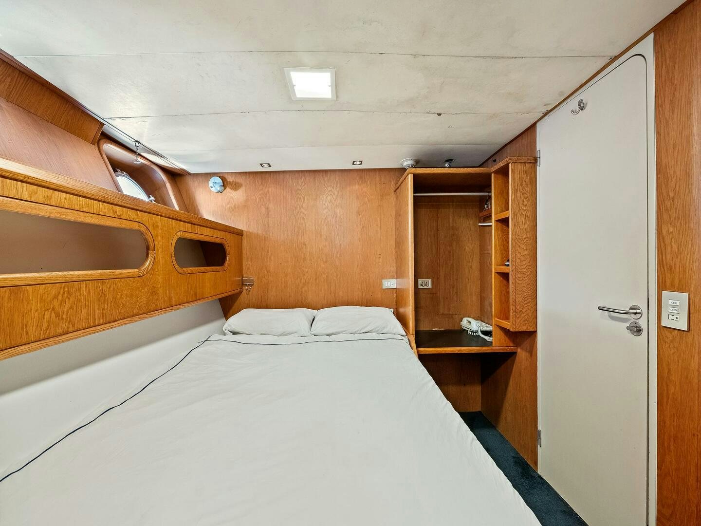 a bed in a room aboard SIENNA Yacht for Sale
