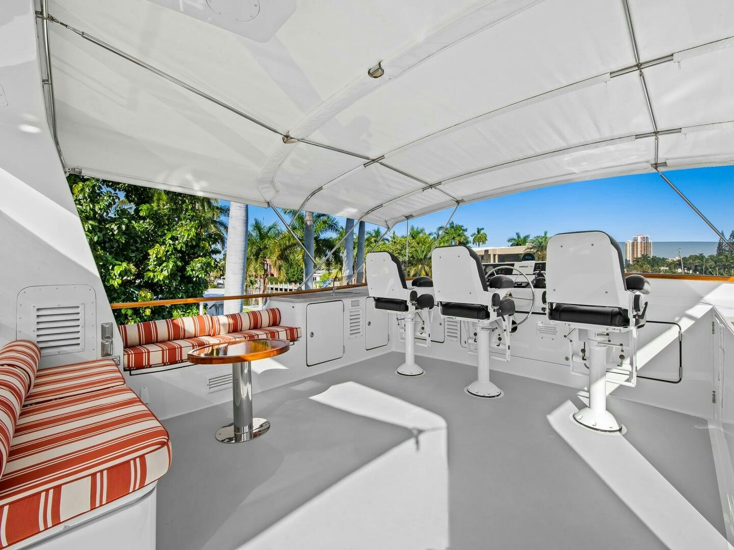 a room with white chairs and tables aboard SIENNA Yacht for Sale