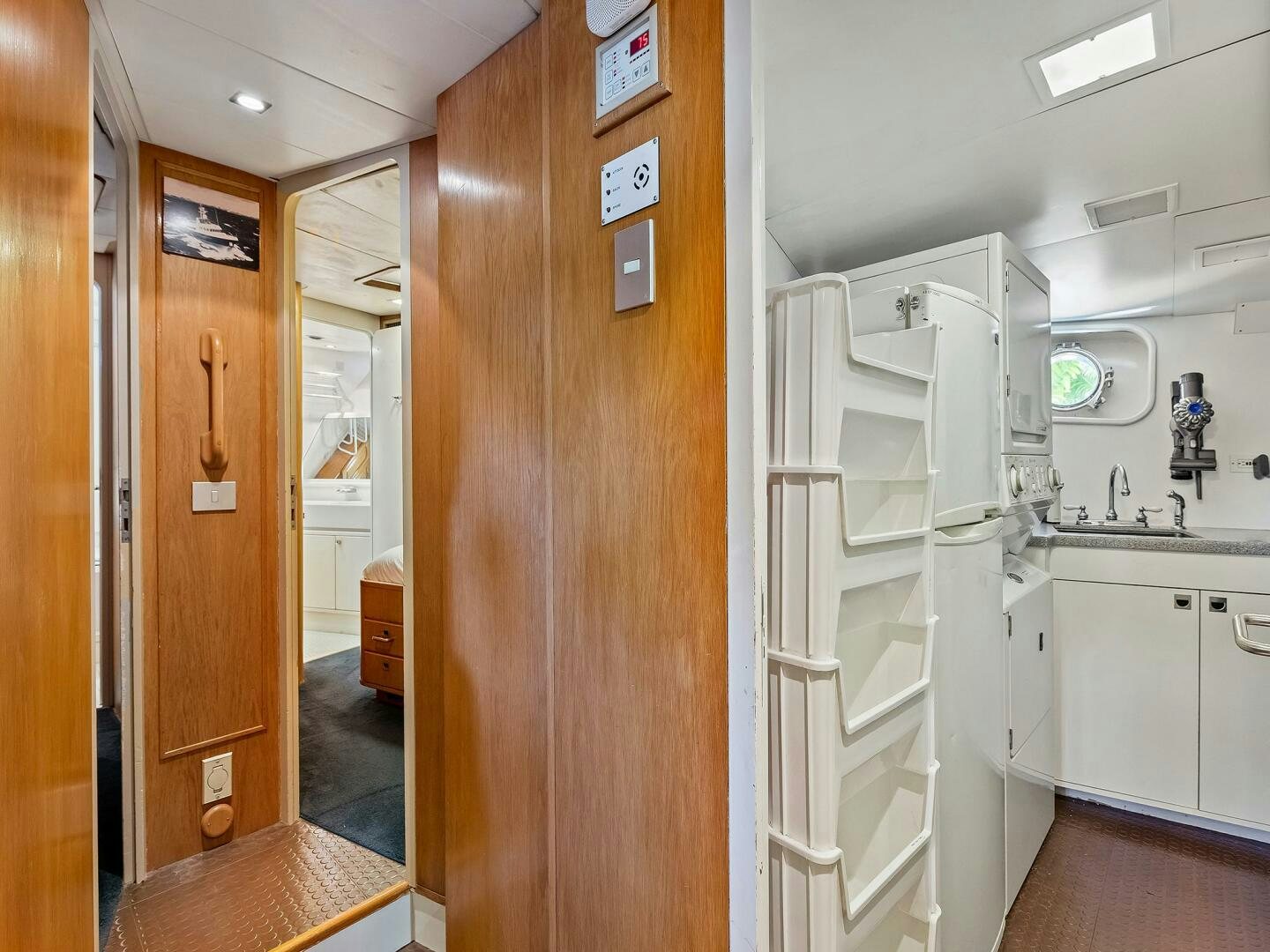 a kitchen with a wood door aboard SIENNA Yacht for Sale