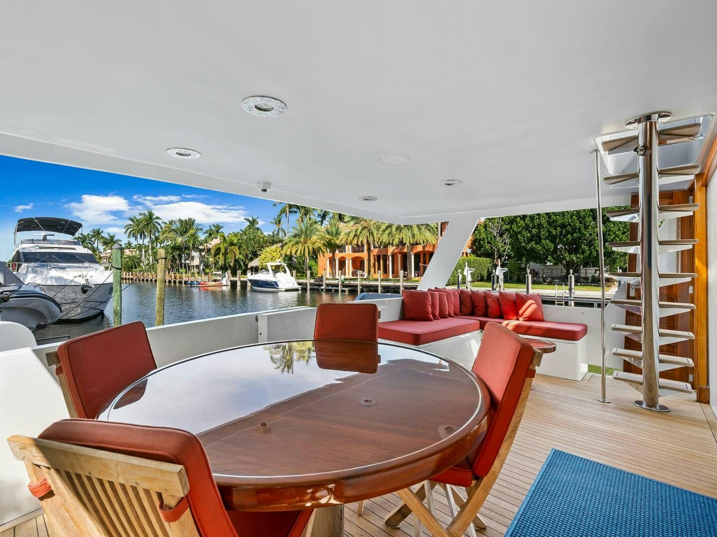 a table and chairs on a deck aboard SIENNA Yacht for Sale