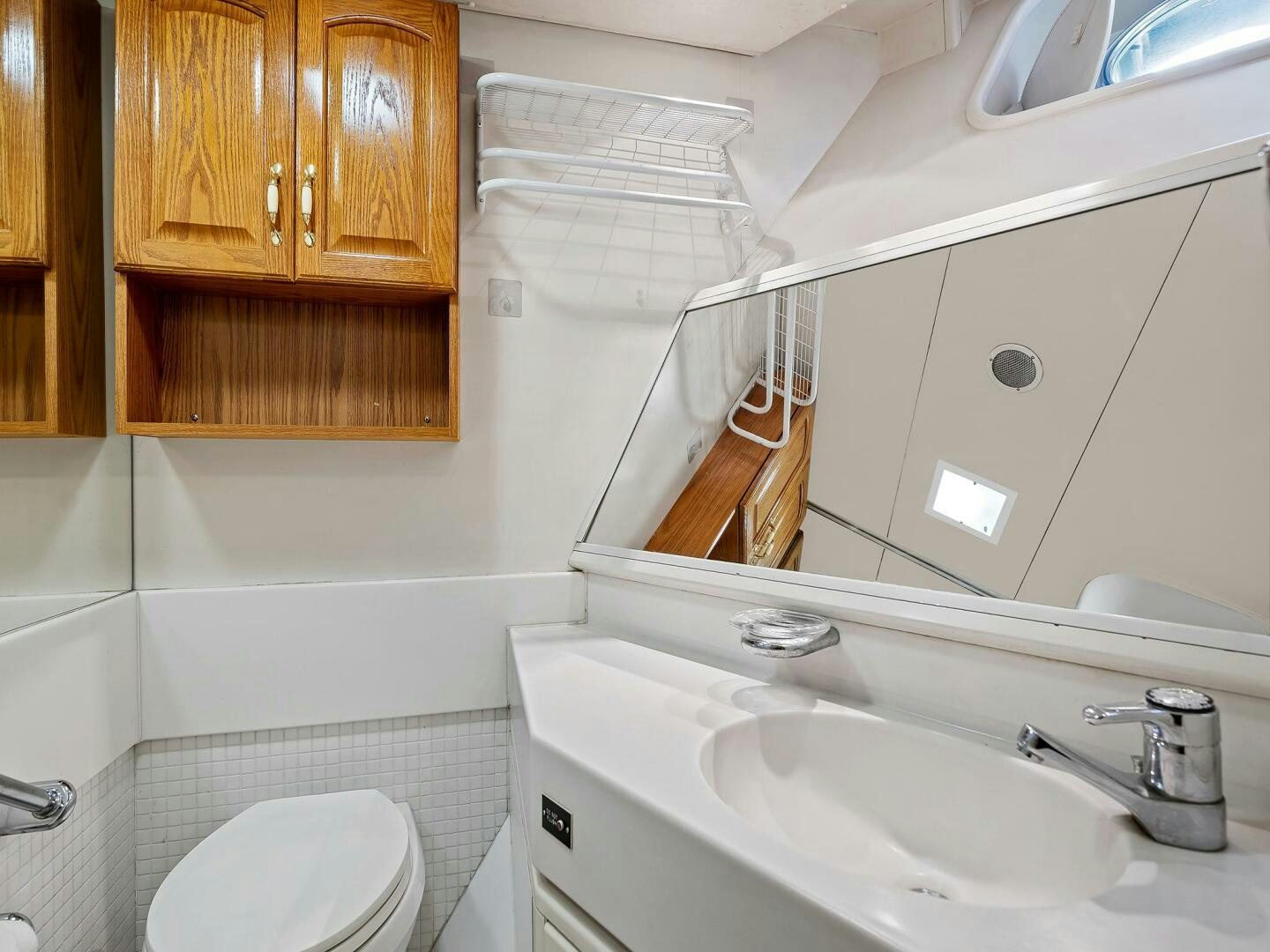 a bathroom with a sink and toilet aboard SIENNA Yacht for Sale