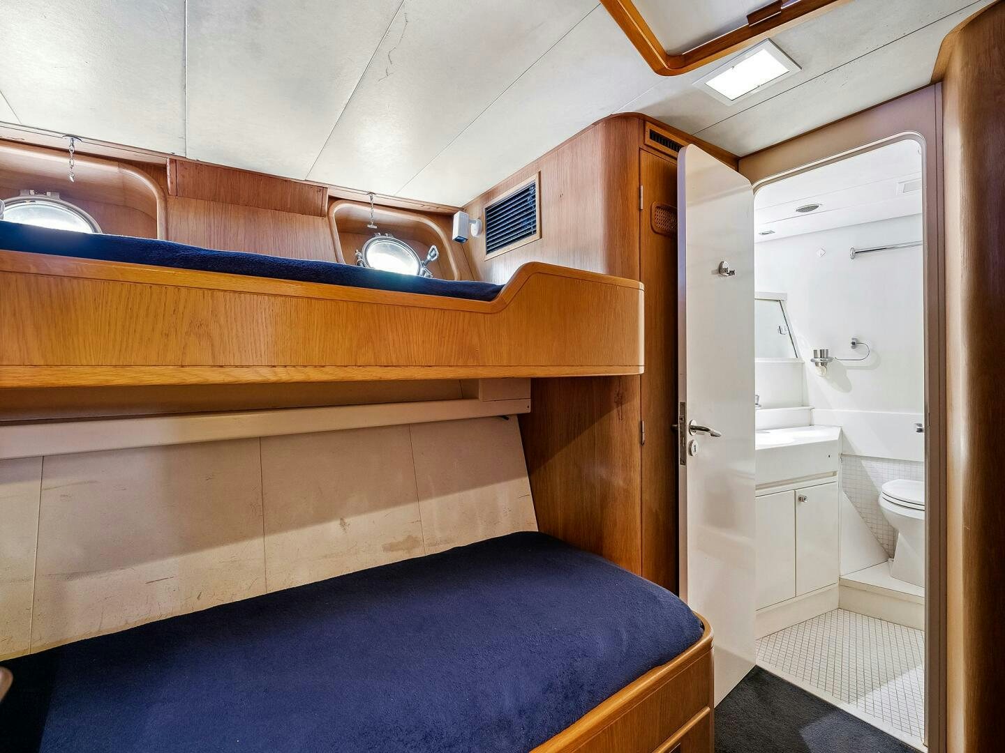 a bathroom with a blue mat aboard SIENNA Yacht for Sale