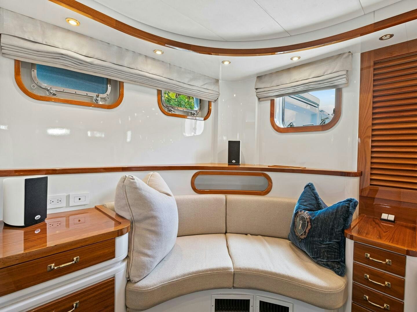 a room with a couch and a dresser aboard SIENNA Yacht for Sale
