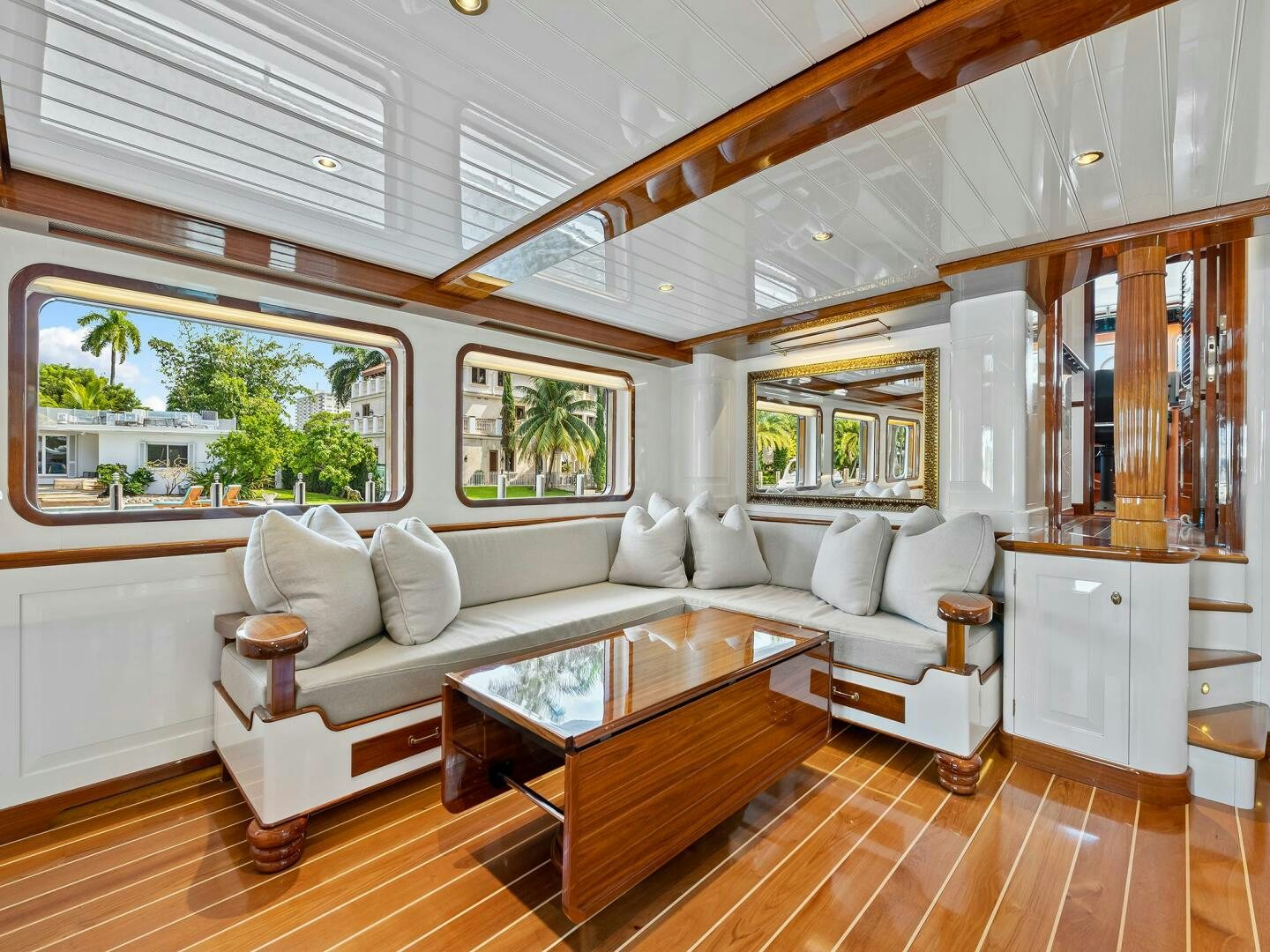a living room with a large window aboard SIENNA Yacht for Sale