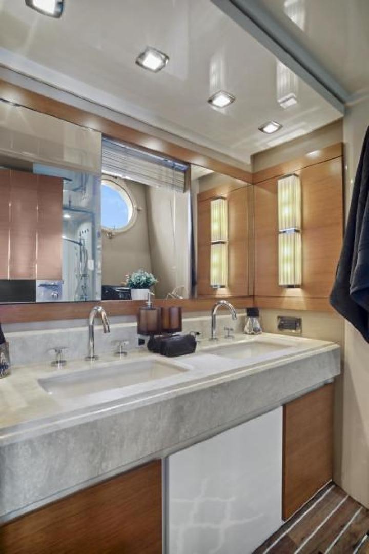 a bathroom with a large mirror aboard WICKED Yacht for Sale