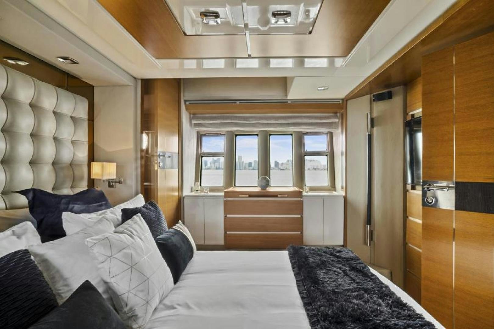 a room with a bed and a closet aboard WICKED Yacht for Sale