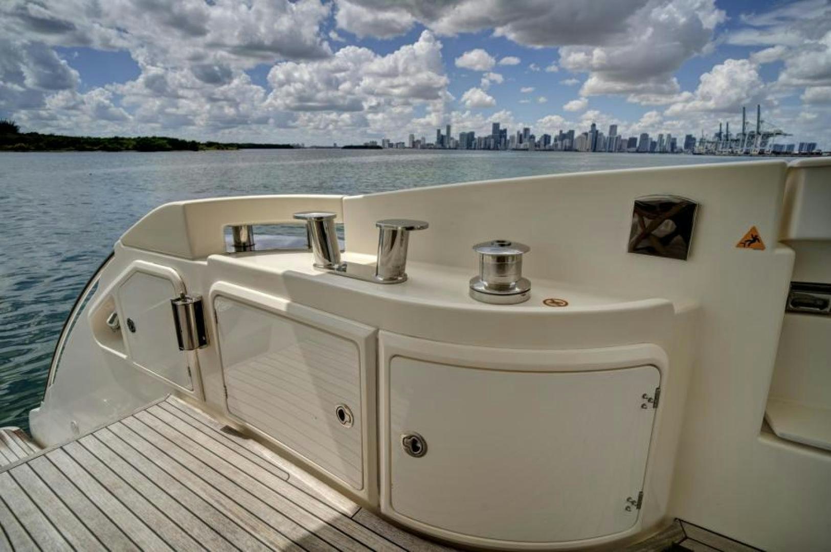 a white boat on a body of water aboard WICKED Yacht for Sale
