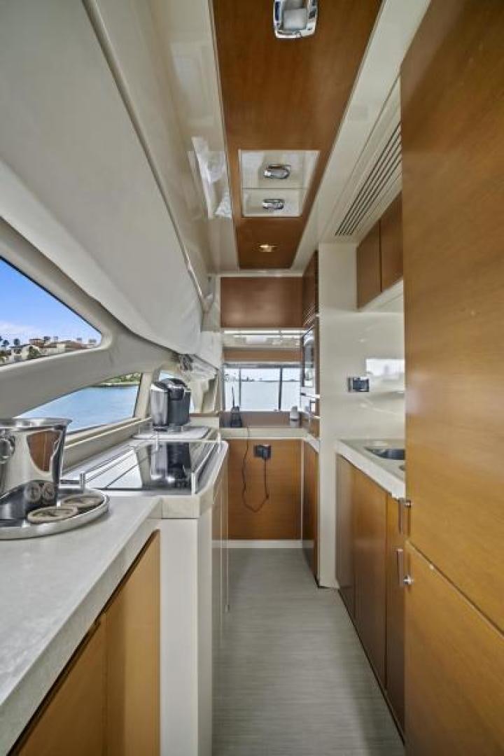 a kitchen with a sink and cabinets aboard WICKED Yacht for Sale