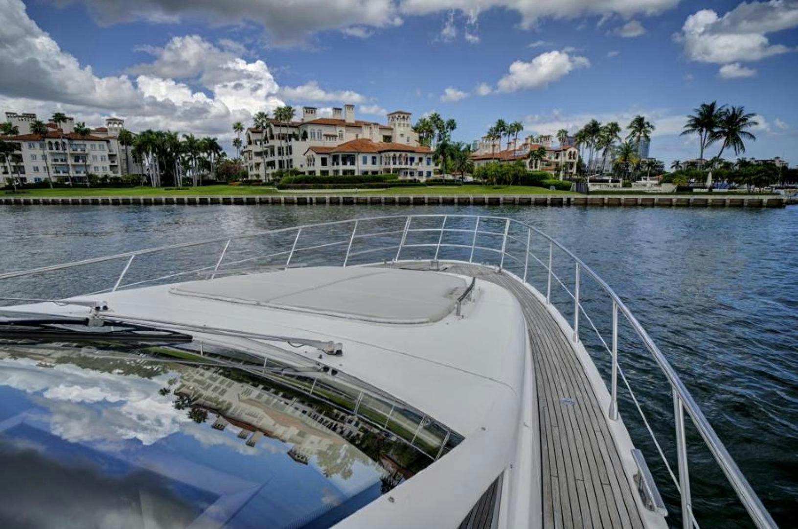 a large white building with a pool aboard WICKED Yacht for Sale