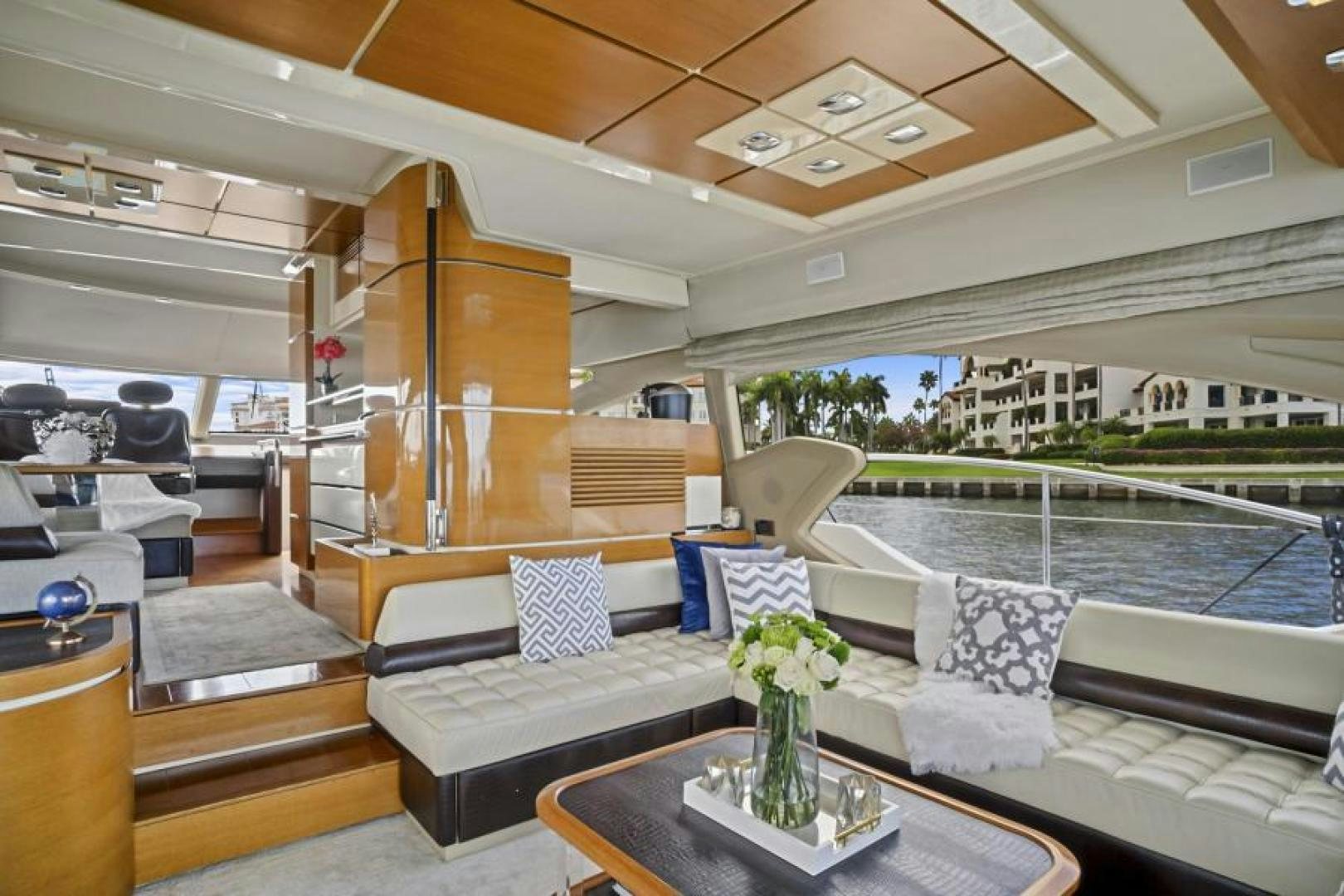a room with a couch and a table and a table aboard WICKED Yacht for Sale