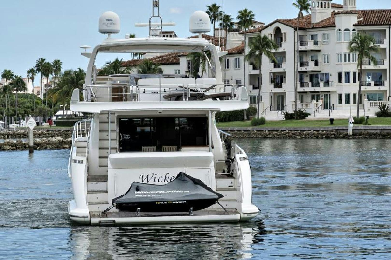 a white boat in the water aboard WICKED Yacht for Sale