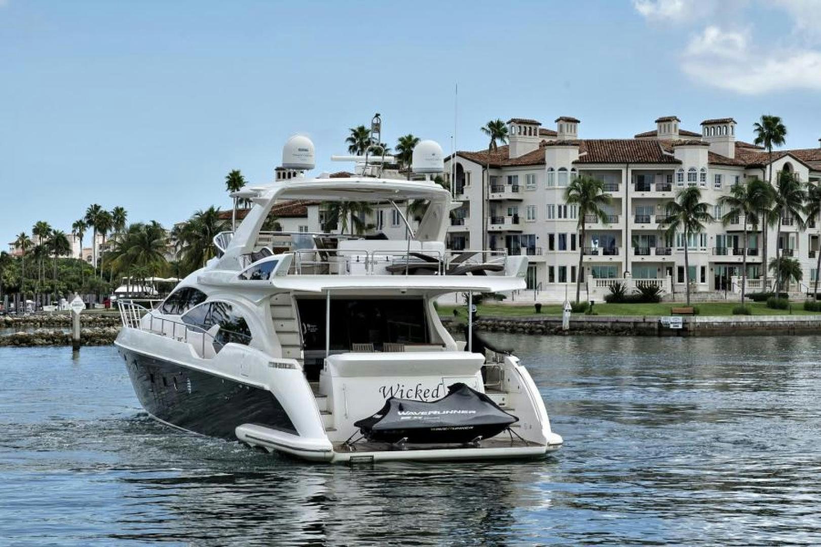 a white boat on the water aboard WICKED Yacht for Sale
