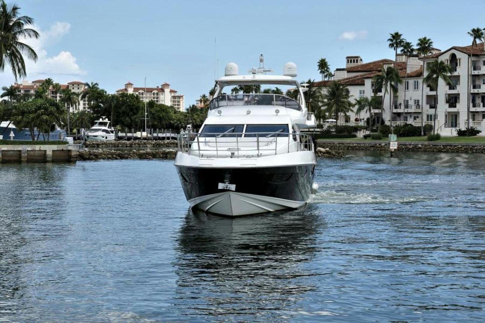 a white boat on the water aboard WICKED Yacht for Sale