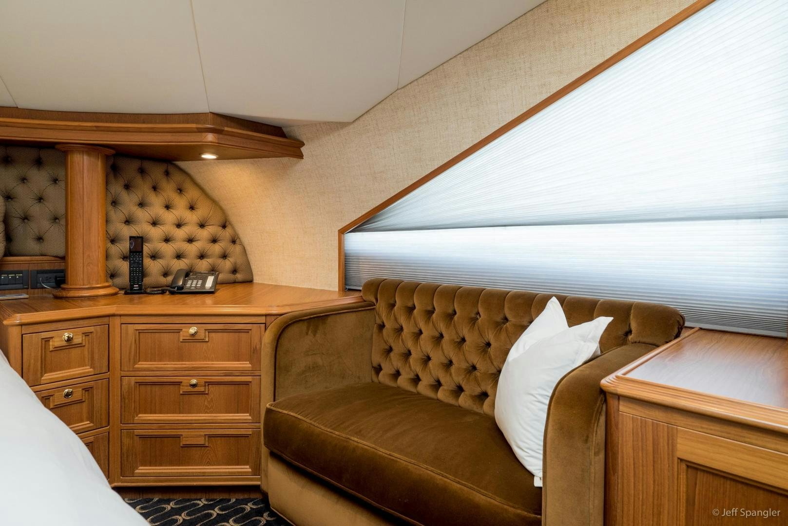 a living room with a couch and a desk aboard LIFE OF RILEY Yacht for Sale