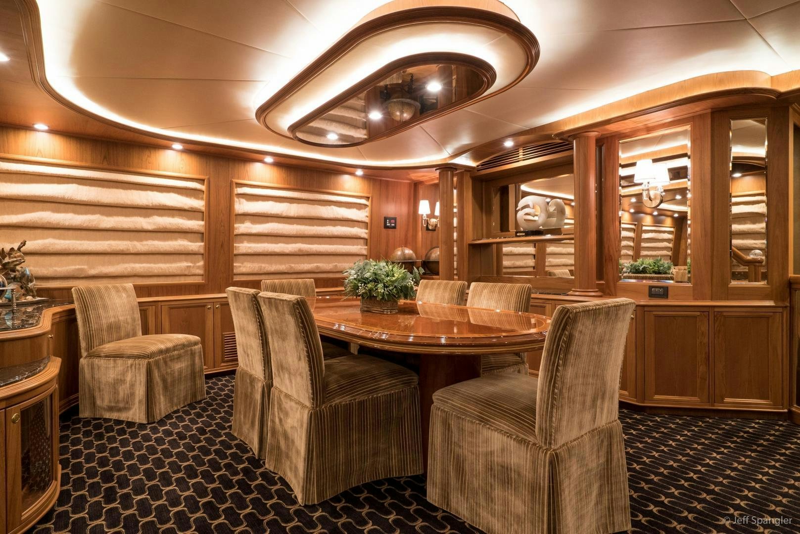 a large room with a table and chairs aboard LIFE OF RILEY Yacht for Sale