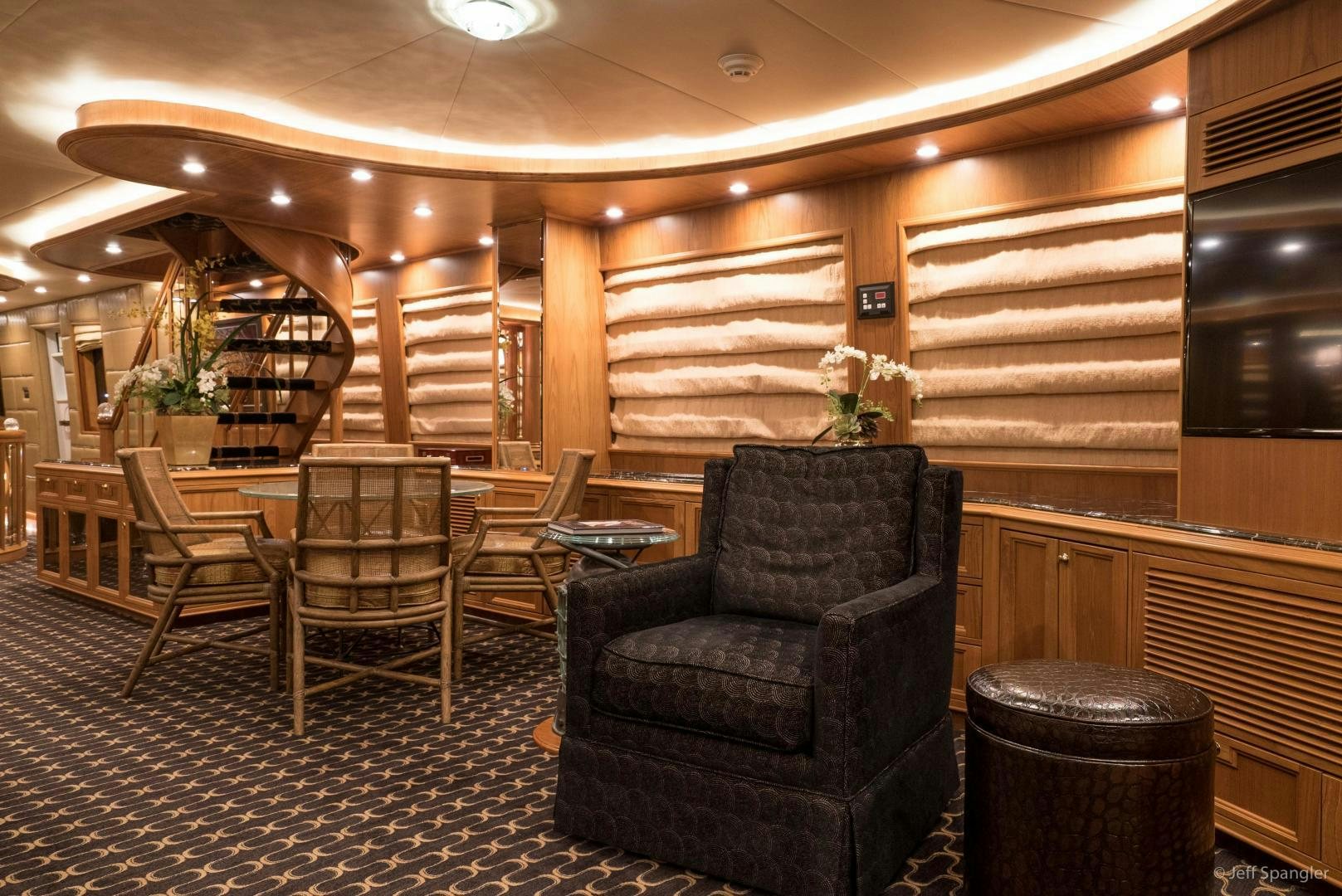 a room with chairs and tables aboard LIFE OF RILEY Yacht for Sale