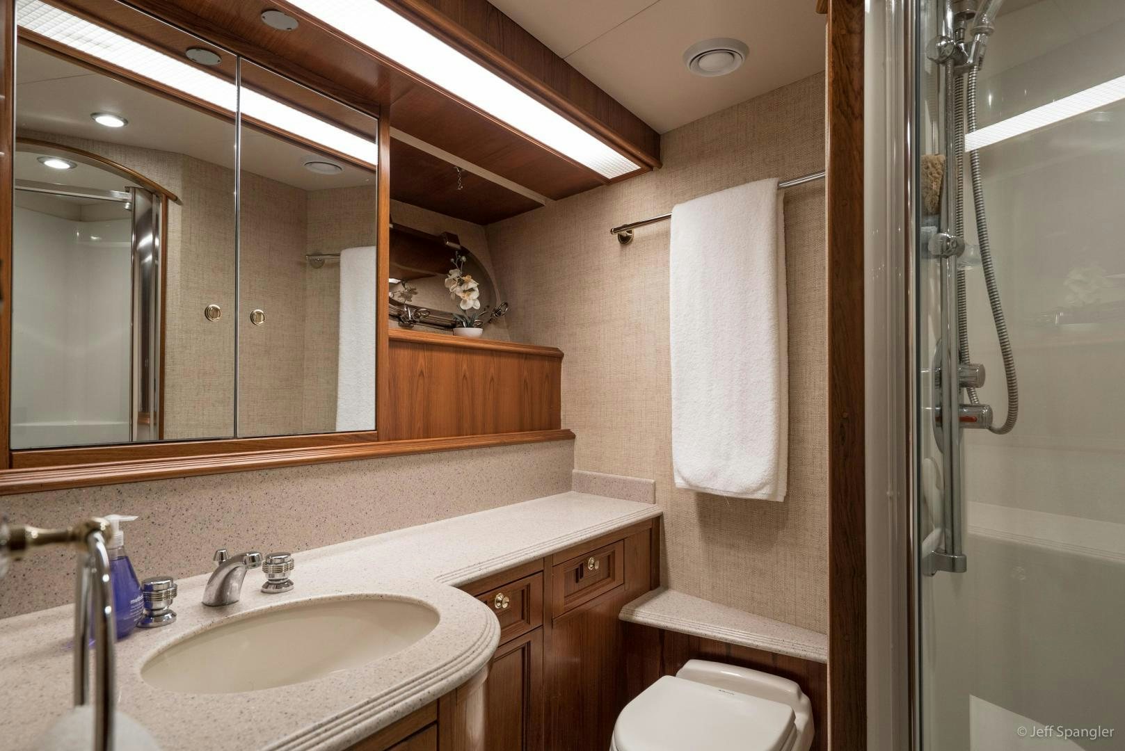 a bathroom with a sink and a mirror aboard LIFE OF RILEY Yacht for Sale
