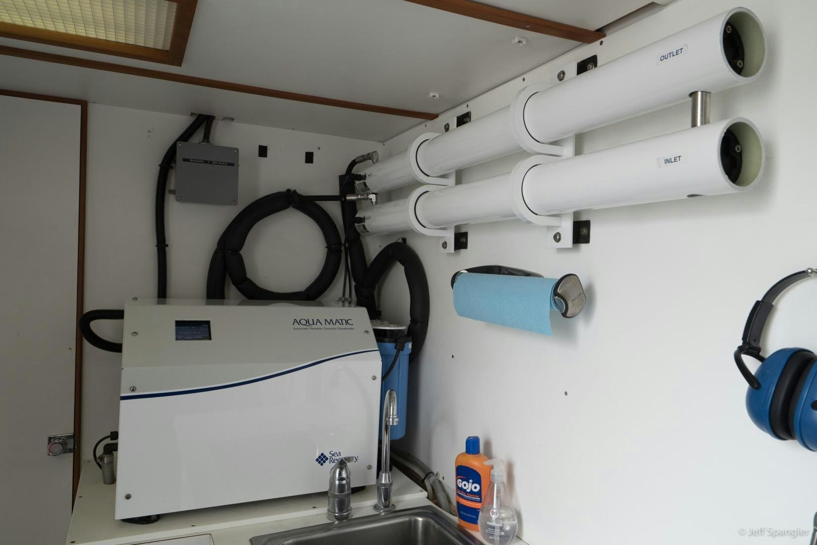 a white machine with a blue tag aboard LIFE OF RILEY Yacht for Sale