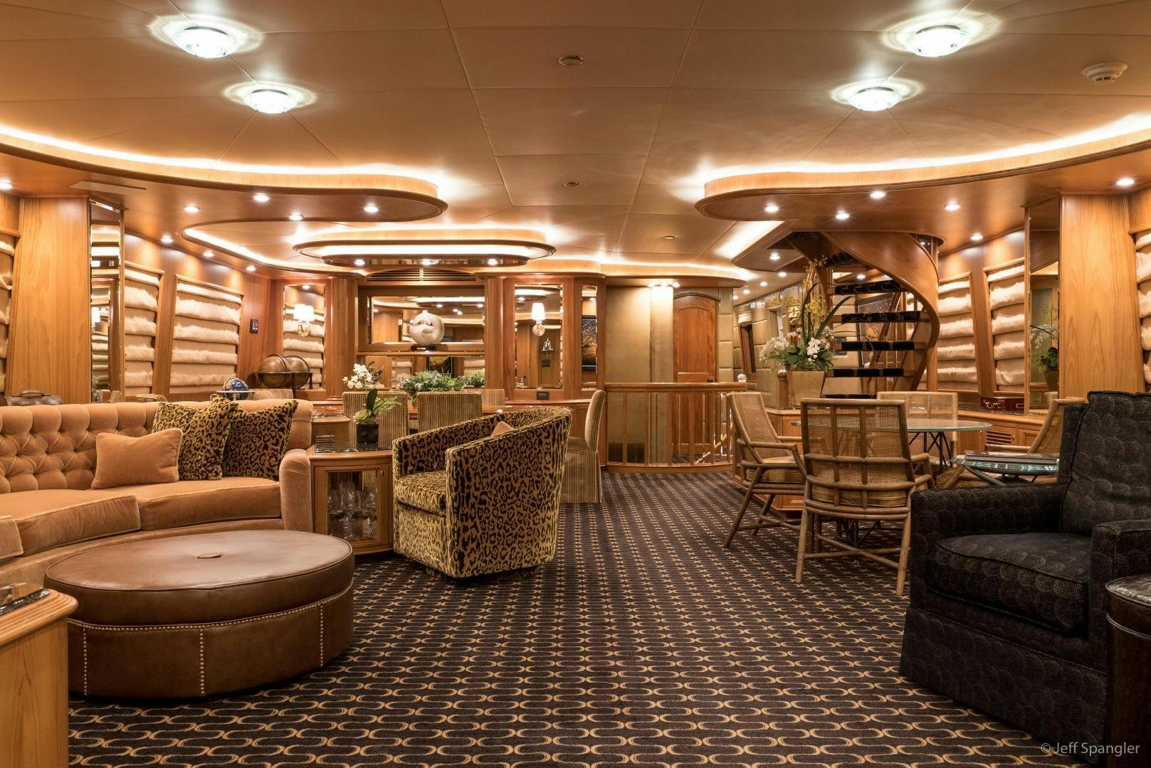 a large living room with a tile floor aboard LIFE OF RILEY Yacht for Sale