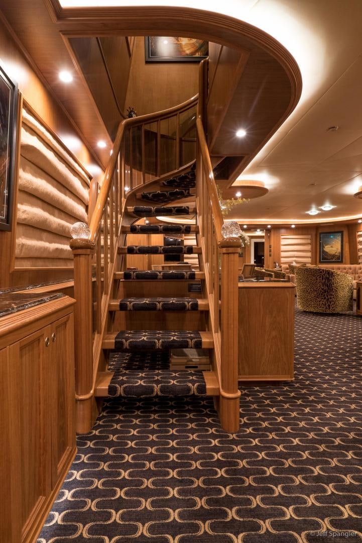 a wooden staircase in a building aboard LIFE OF RILEY Yacht for Sale