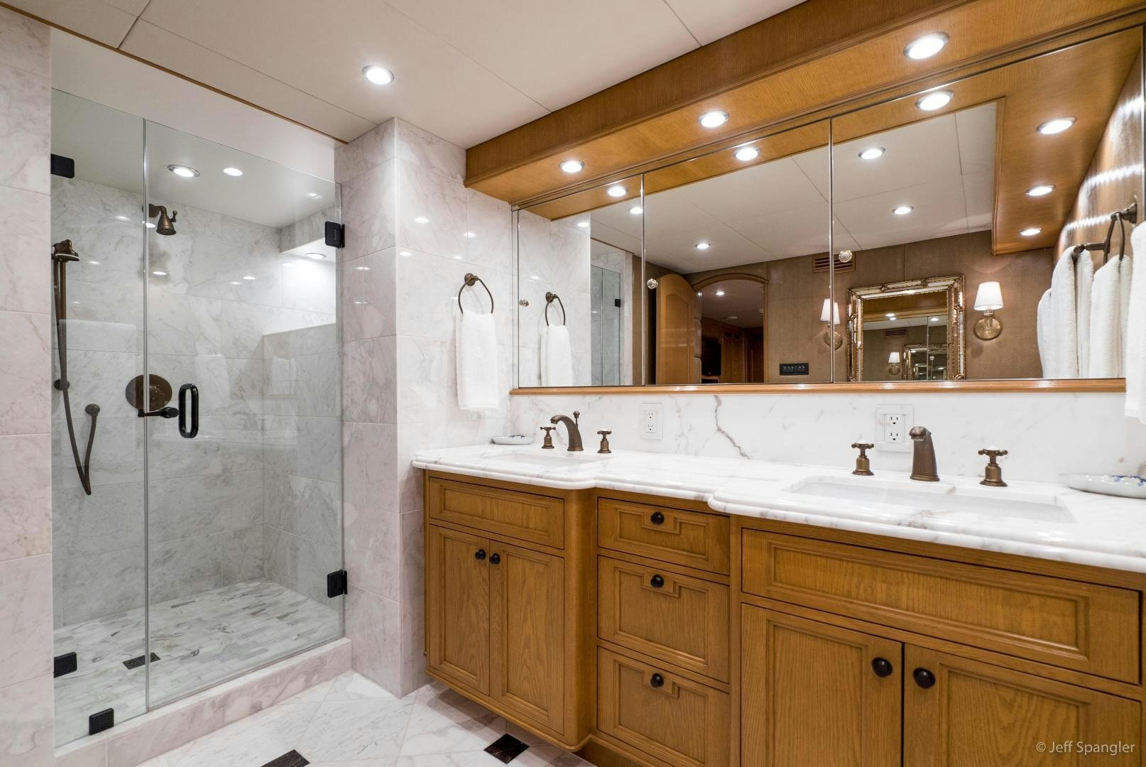 a bathroom with a glass shower aboard LIFE OF RILEY Yacht for Sale