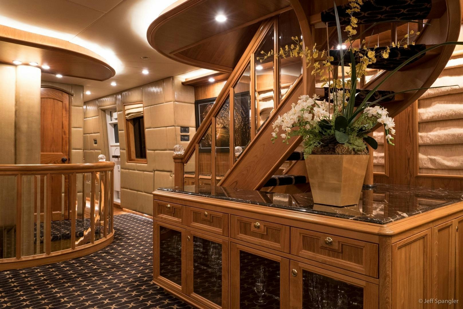 a large kitchen with a staircase aboard LIFE OF RILEY Yacht for Sale