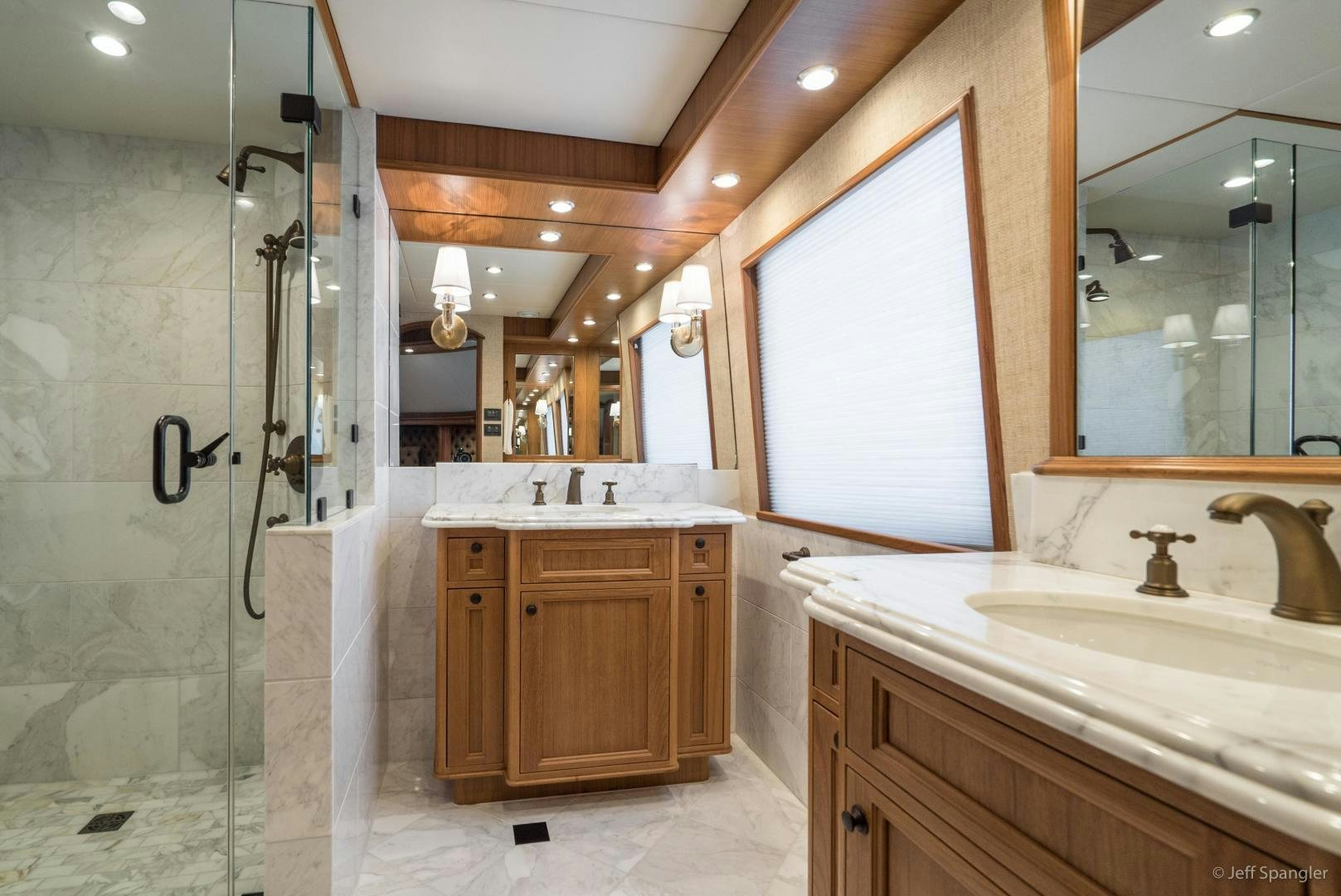 a bathroom with a glass shower aboard LIFE OF RILEY Yacht for Sale