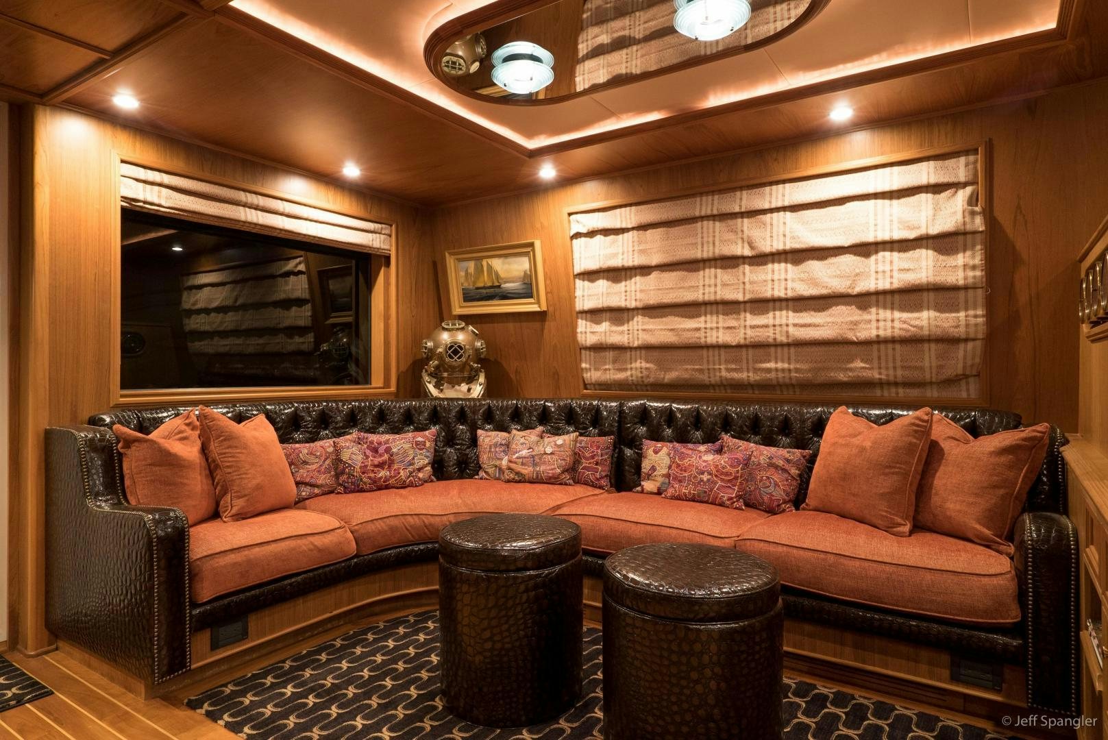 a living room with a couch and a table aboard LIFE OF RILEY Yacht for Sale