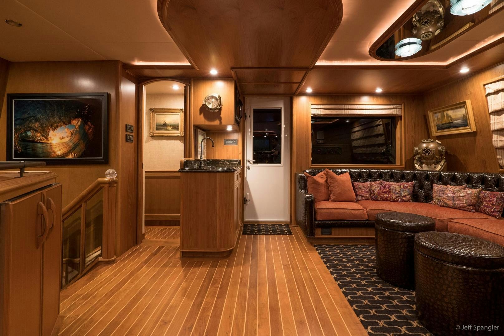 a living room with a large fireplace aboard LIFE OF RILEY Yacht for Sale
