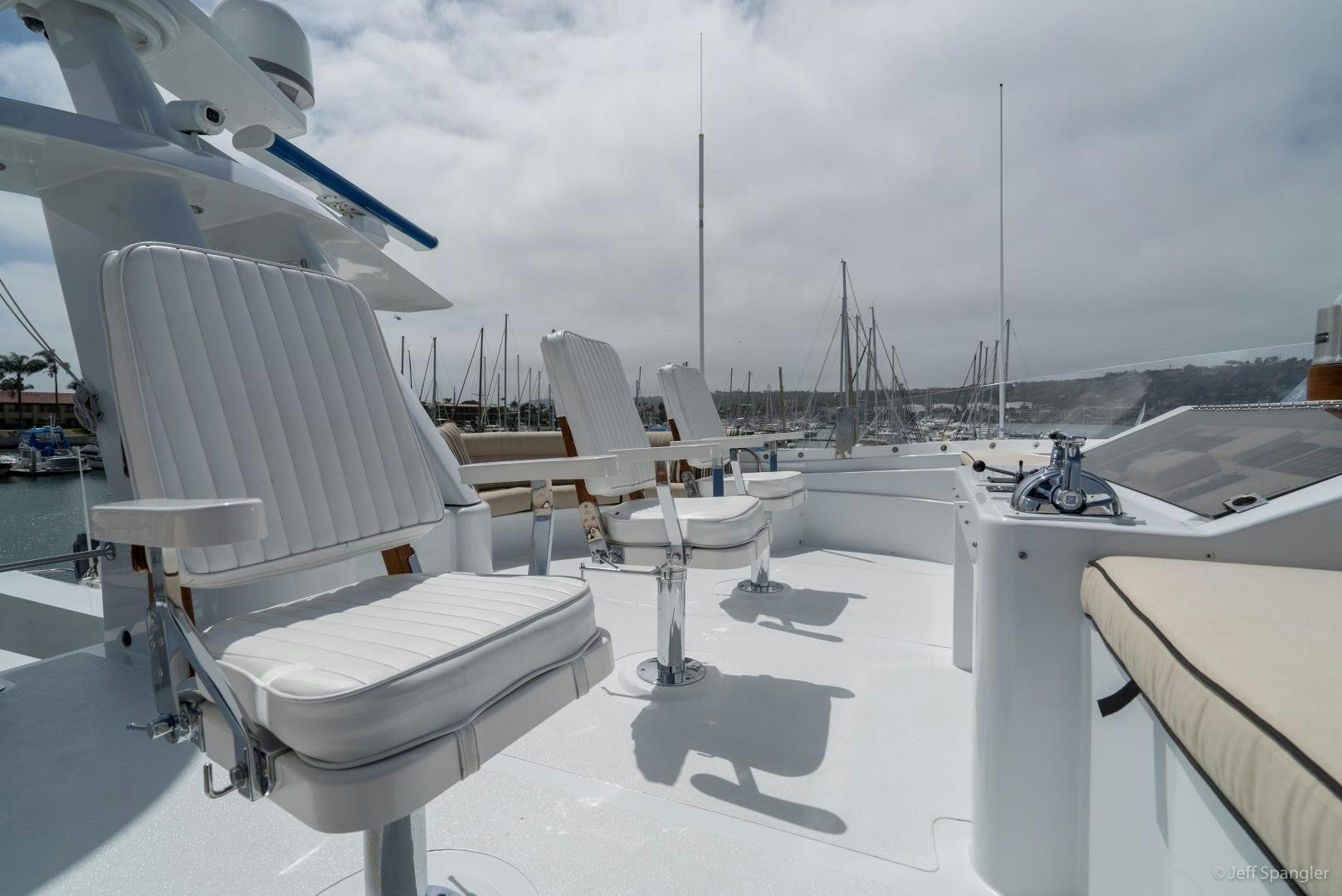 a group of white boats on a dock aboard LIFE OF RILEY Yacht for Sale