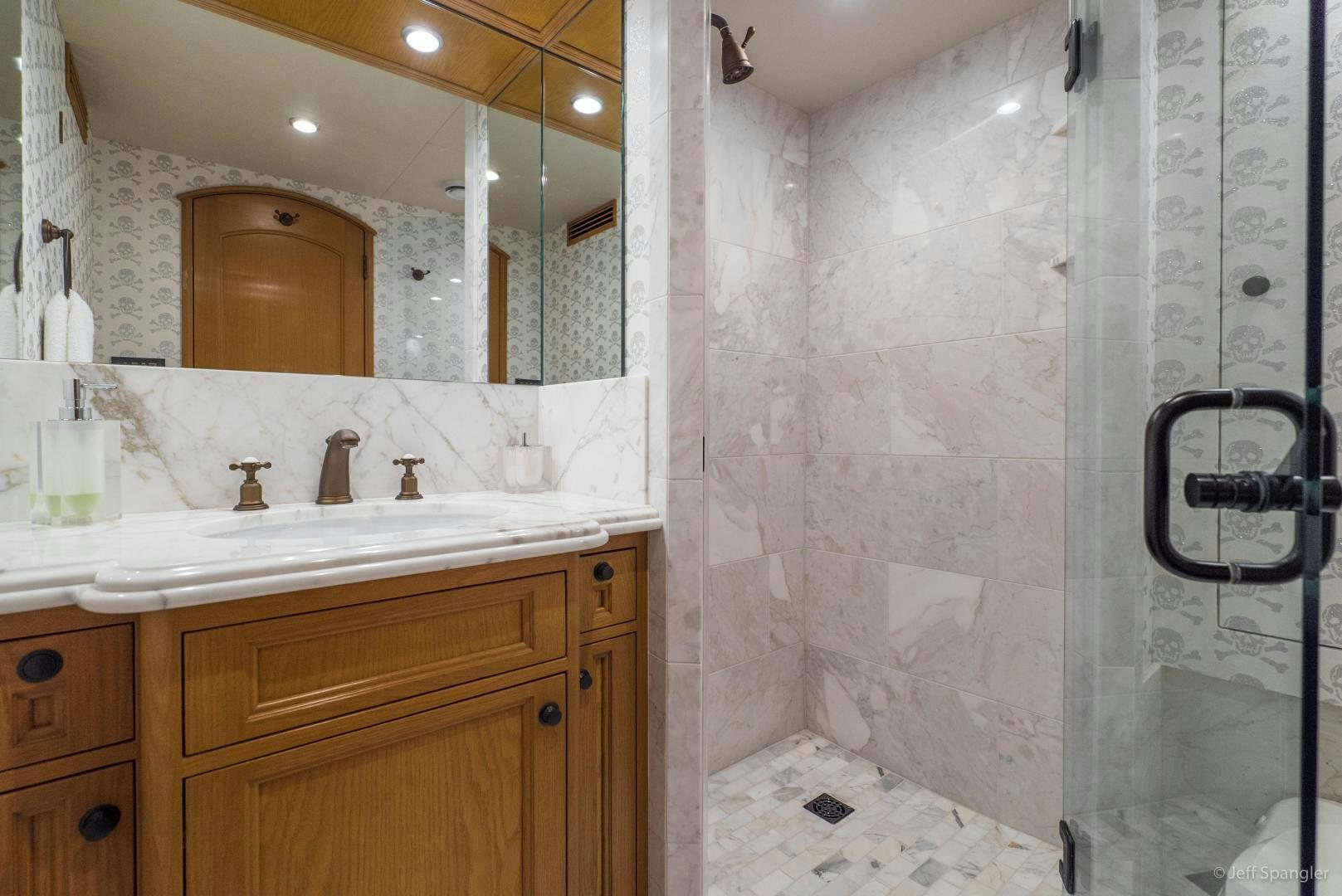 a bathroom with a large mirror aboard LIFE OF RILEY Yacht for Sale