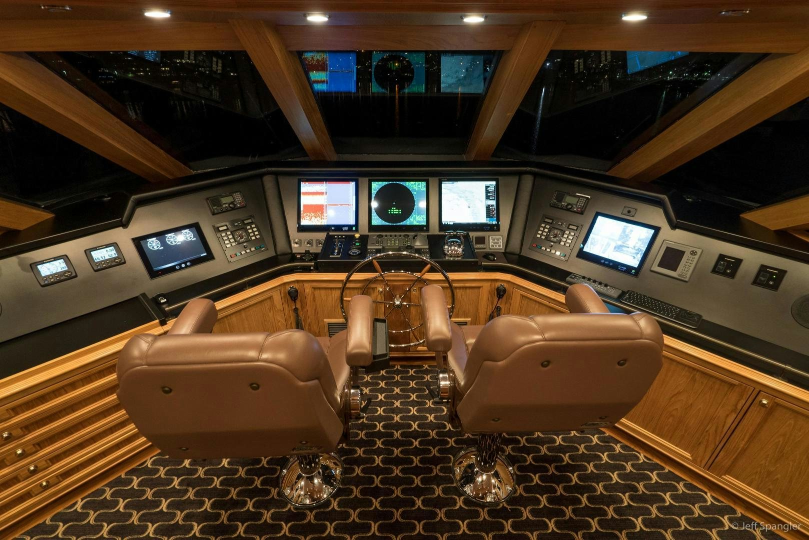 a room with many screens and a chair aboard LIFE OF RILEY Yacht for Sale
