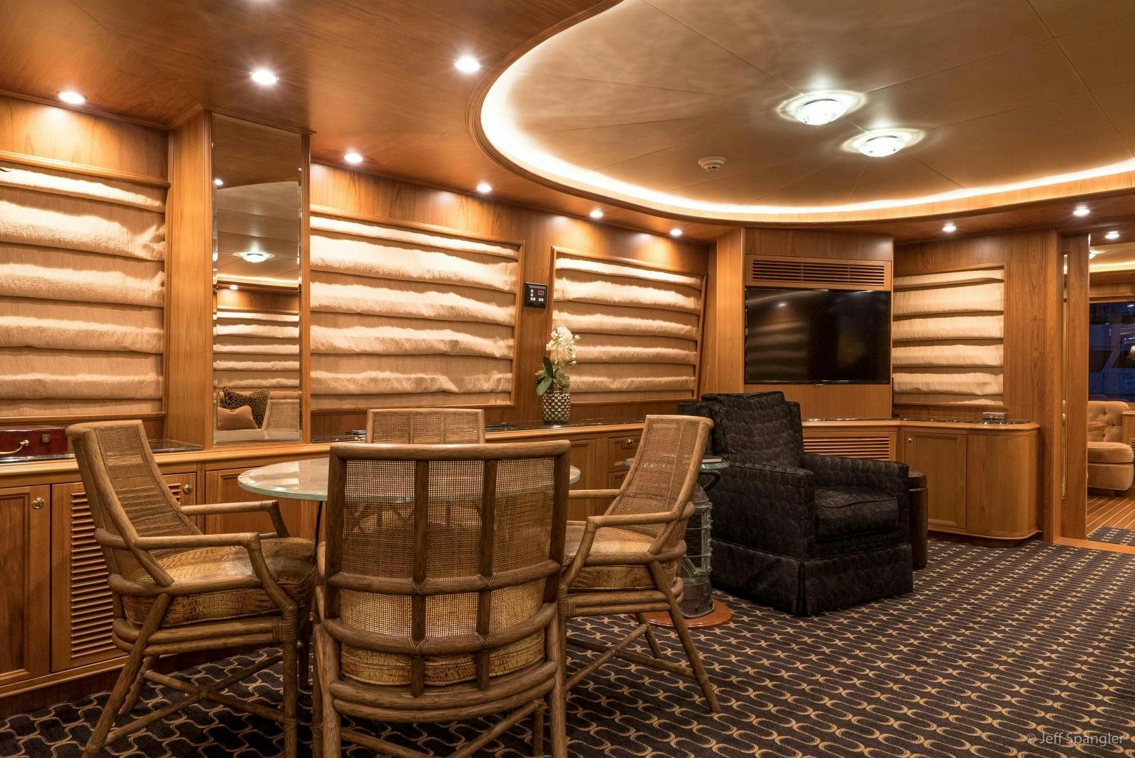 a room with a couch and chairs aboard LIFE OF RILEY Yacht for Sale