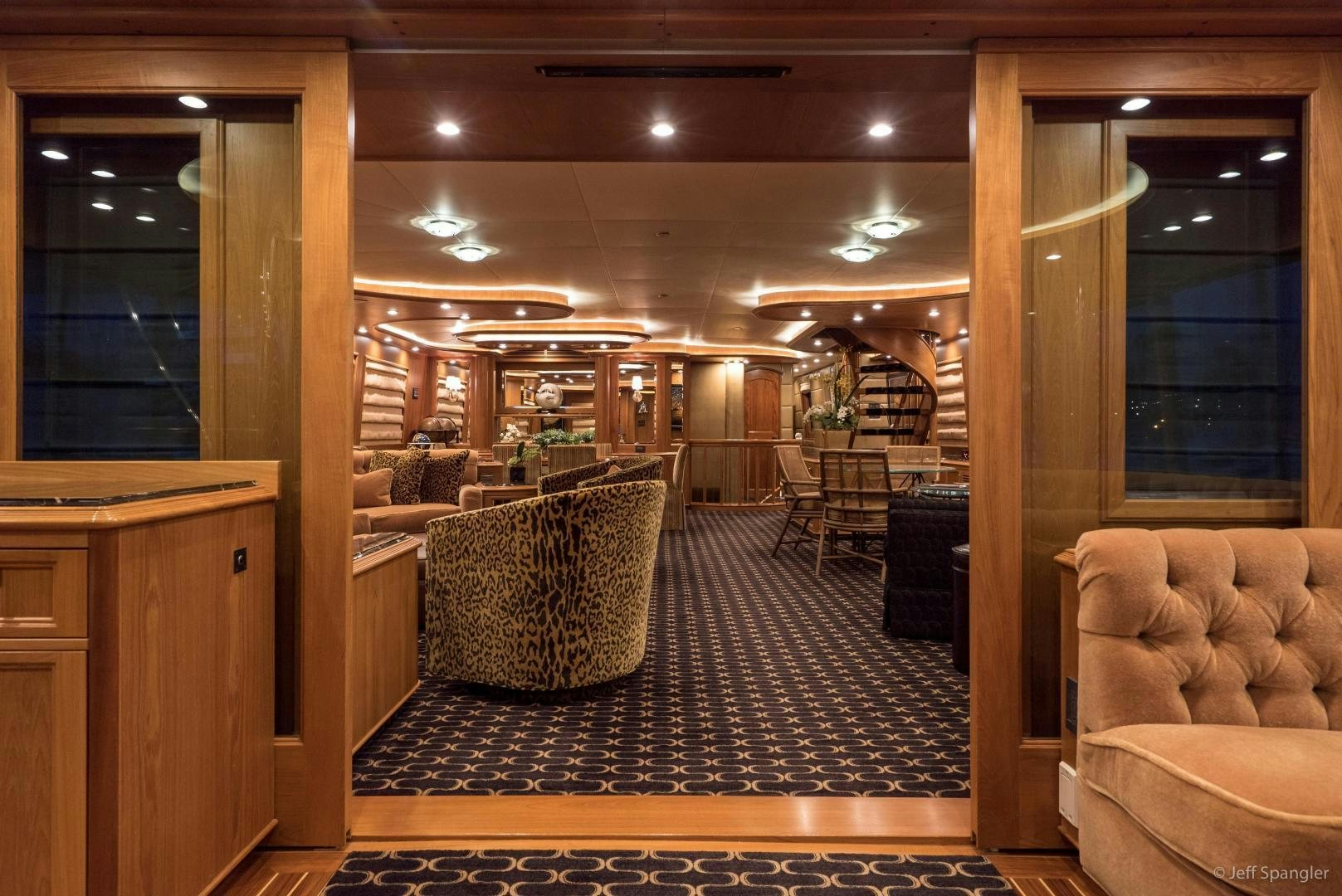 a room with a couch and a table and chairs aboard LIFE OF RILEY Yacht for Sale