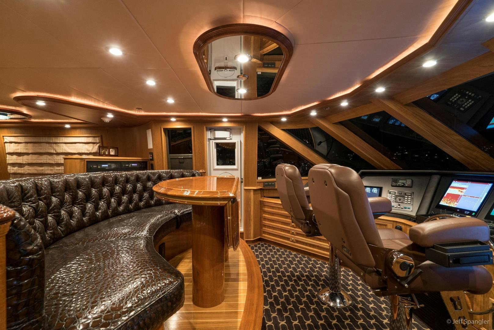 a leather couch and chairs in a room with a table and chairs aboard LIFE OF RILEY Yacht for Sale