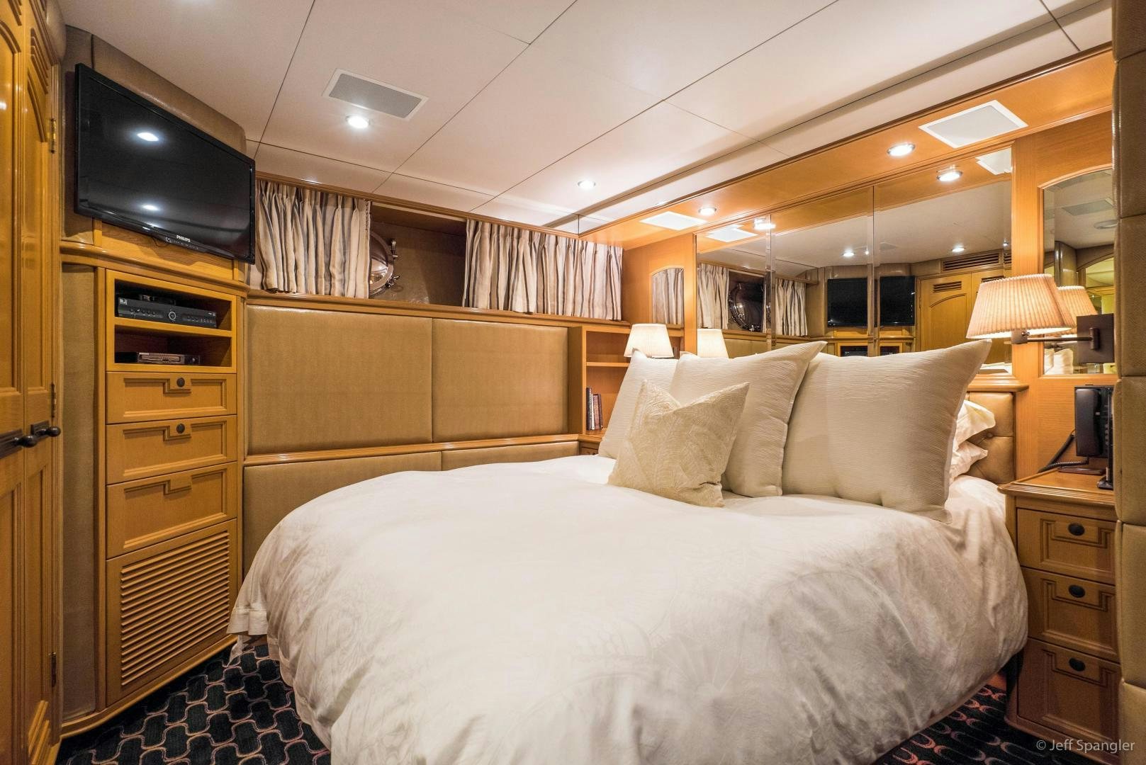 a bed with white sheets aboard LIFE OF RILEY Yacht for Sale
