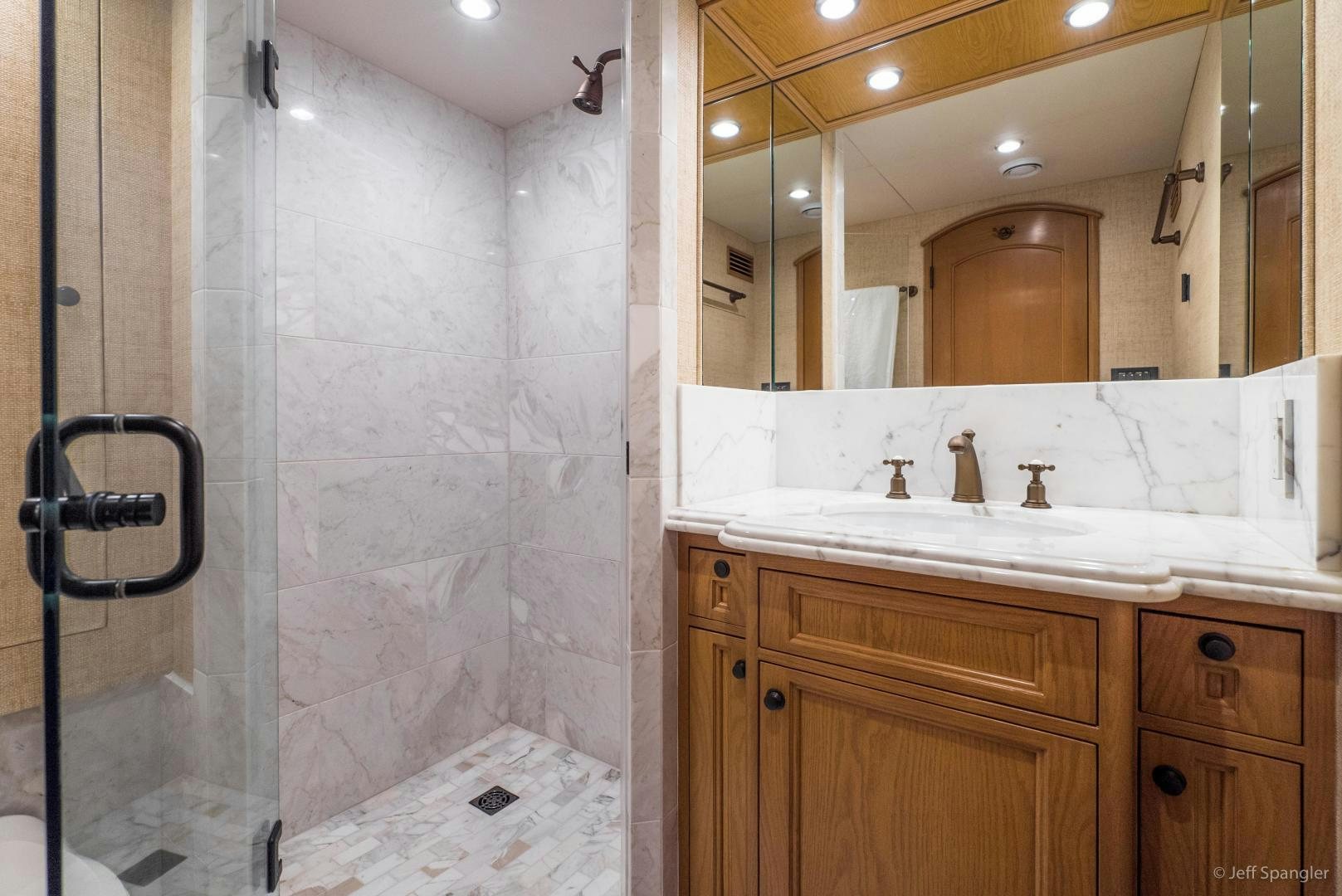 a bathroom with a large mirror aboard LIFE OF RILEY Yacht for Sale