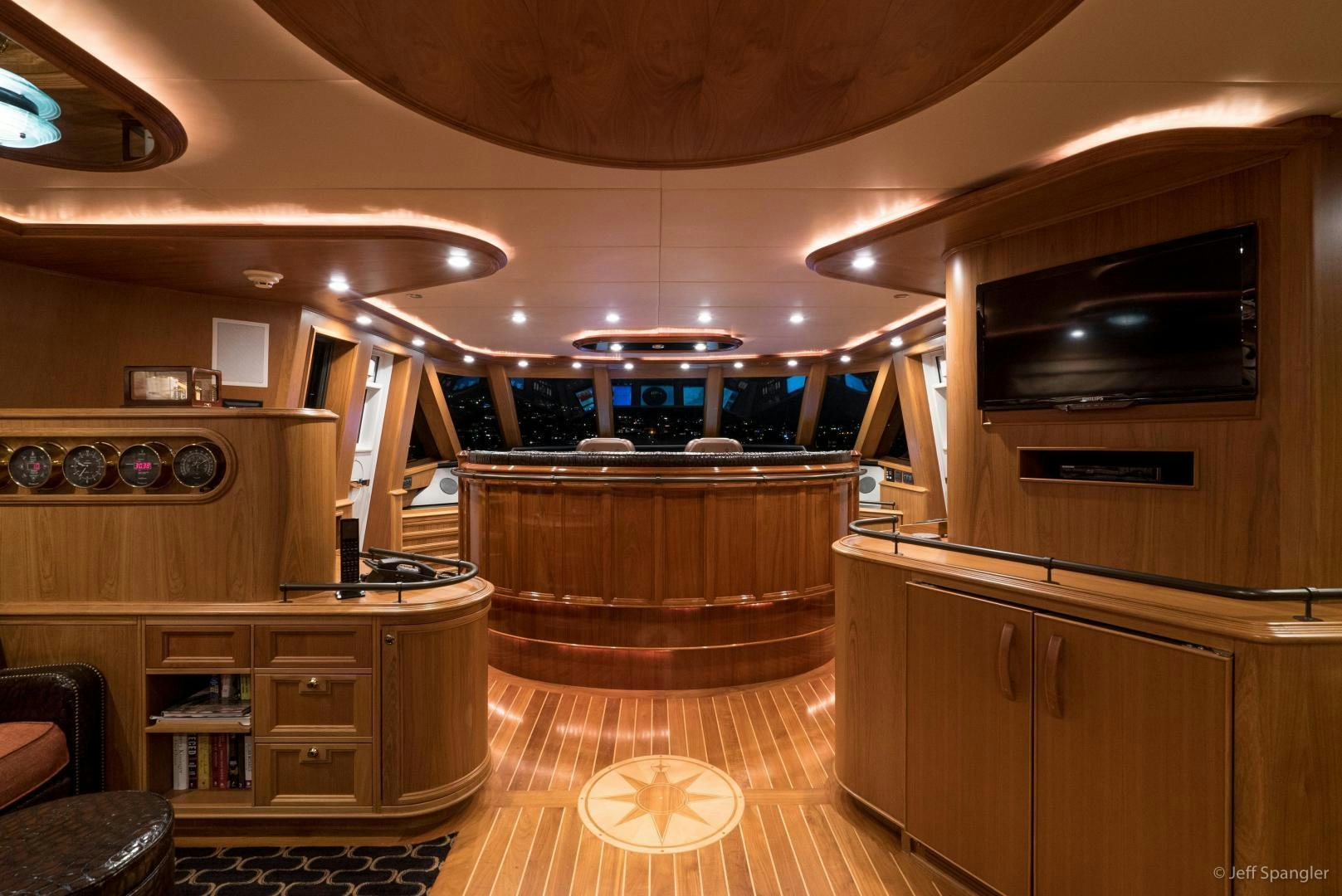 a kitchen with wooden cabinets aboard LIFE OF RILEY Yacht for Sale