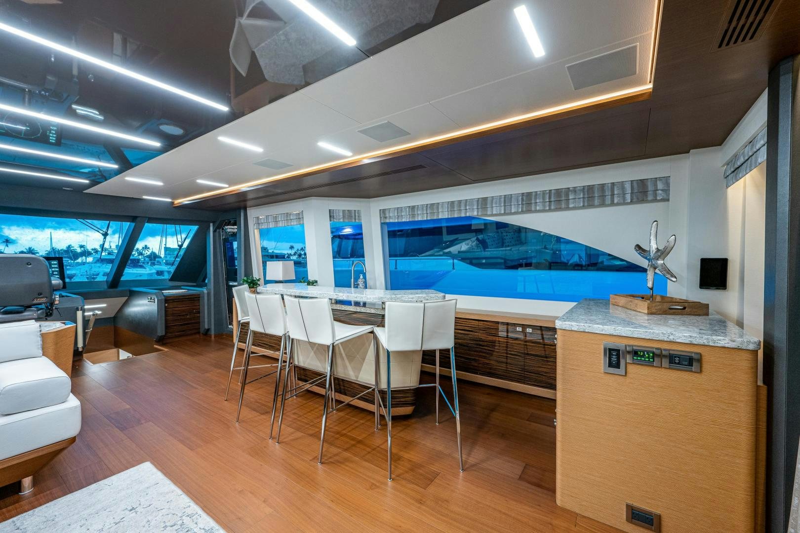 a room with a large pool table and chairs aboard SEAMENT Yacht for Sale