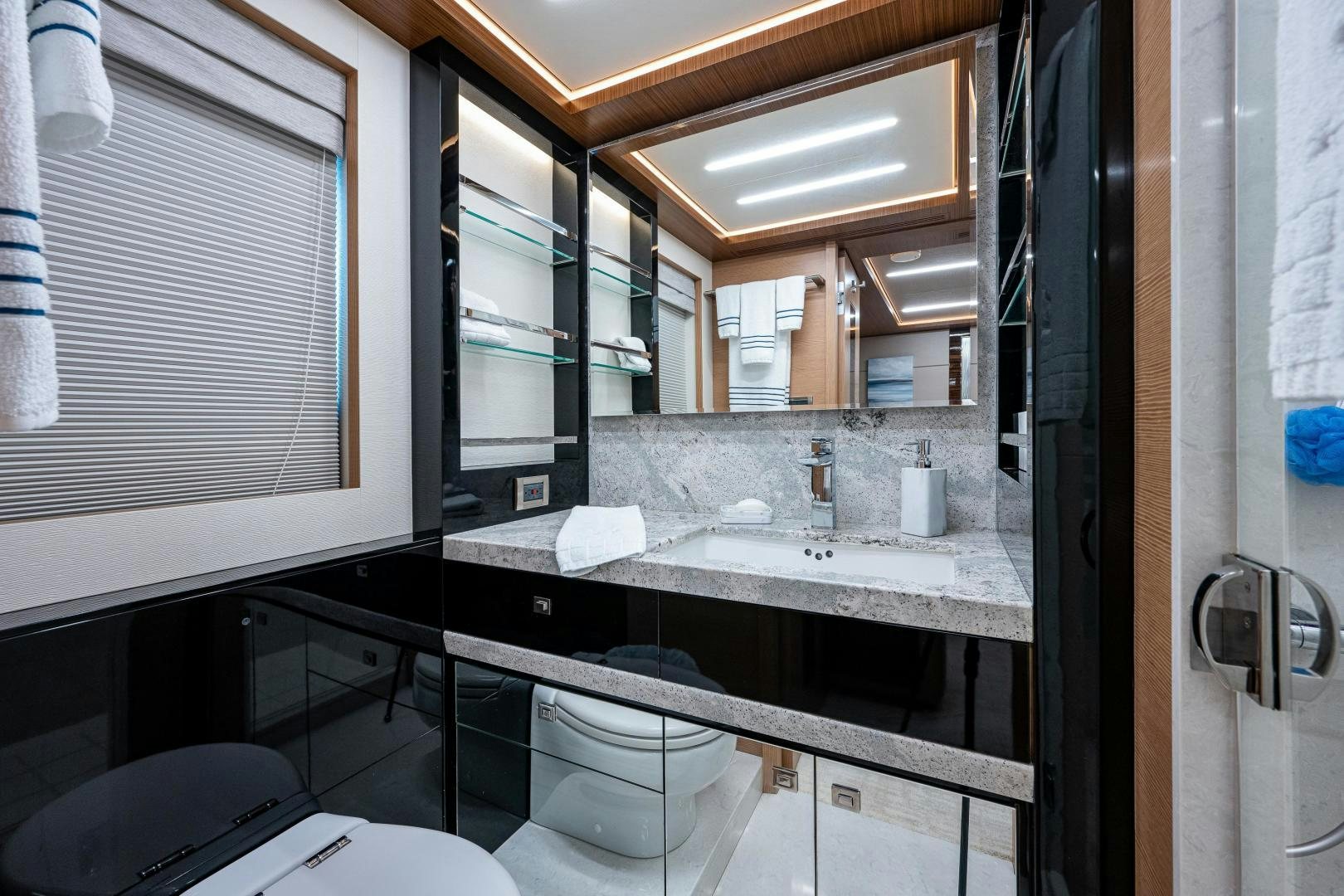 a bathroom with a large mirror aboard SEAMENT Yacht for Sale
