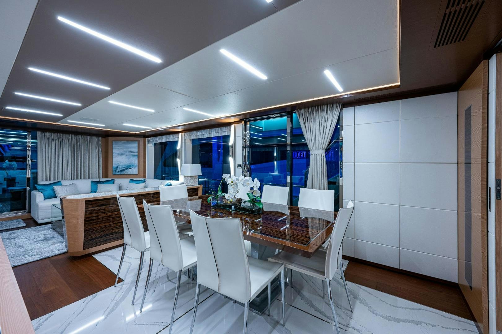 a room with a table chairs and a large window aboard SEAMENT Yacht for Sale