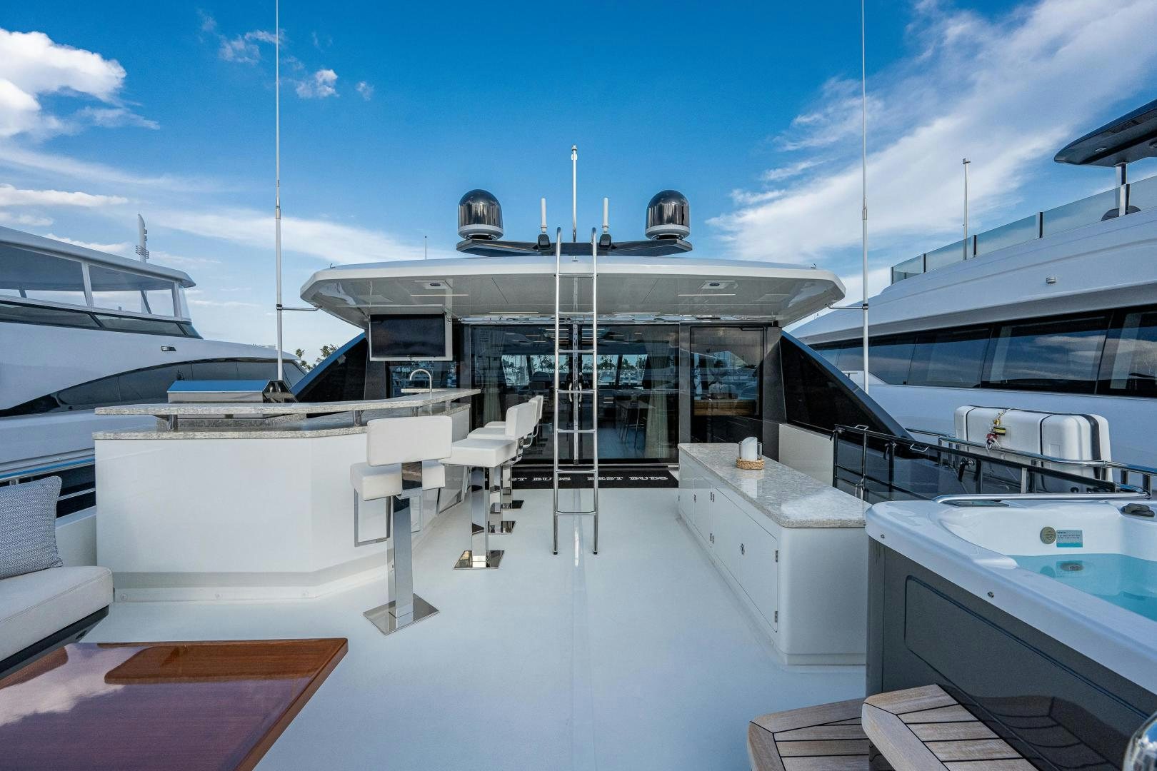 a large white building with a dome roof and a deck with chairs aboard SEAMENT Yacht for Sale