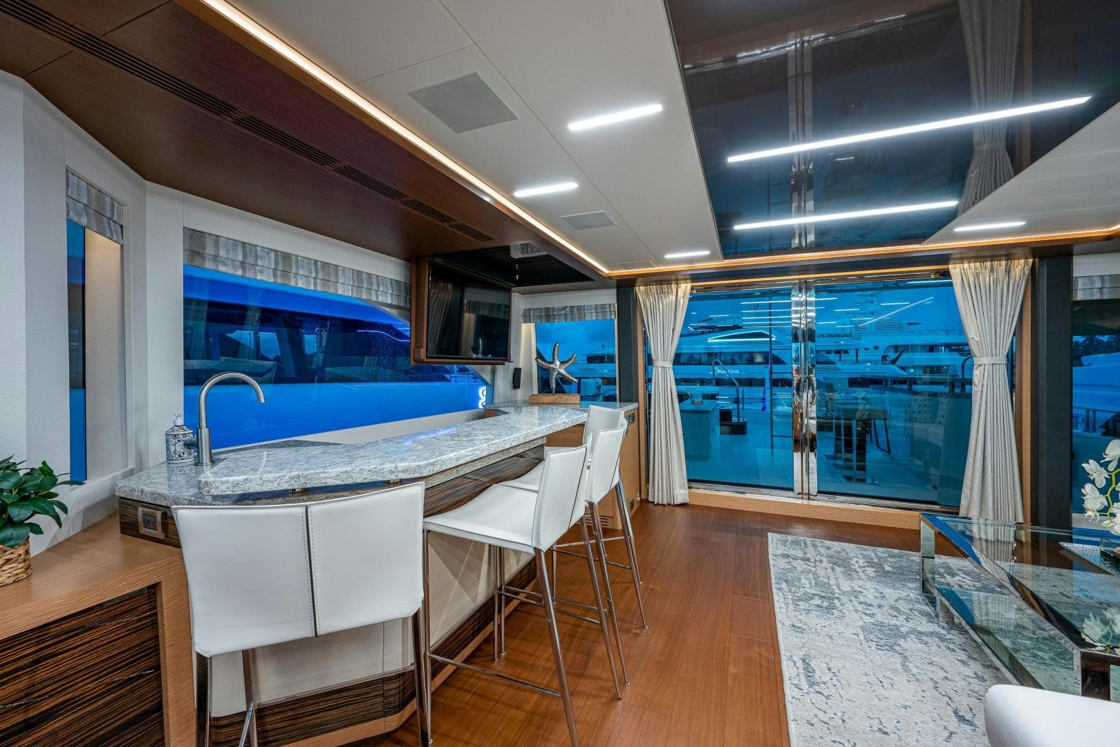 a room with a table and chairs aboard SEAMENT Yacht for Sale