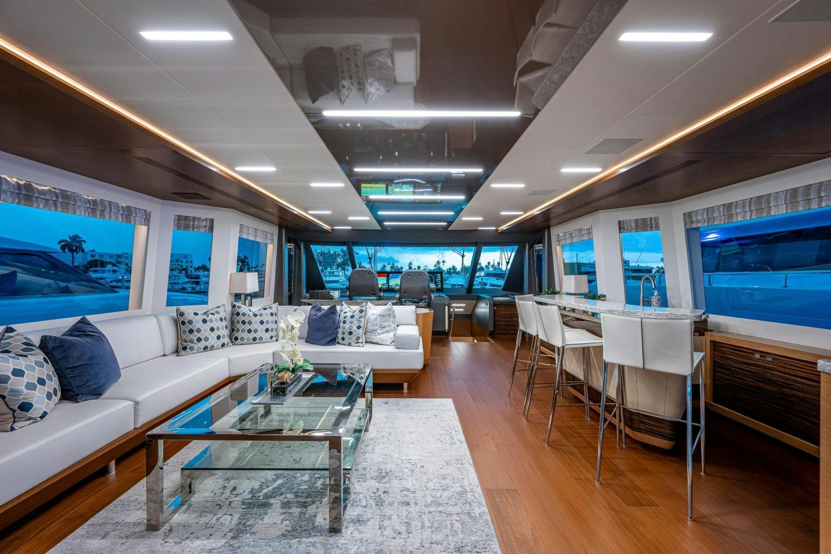 a living room with a large screen aboard SEAMENT Yacht for Sale